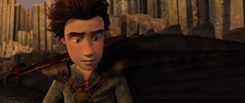 Movie still from “How to Train Your Dragon” (2010), directed by Chris Sanders – A boy is looking at the camera in a scene from a movie; Close Up shot, Over the shoulder angle