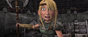 Movie still from “How to Train Your Dragon” (2010), directed by Chris Sanders – A cartoon of a woman with blonde hair and a helmet on her head; Medium shot, Low angle