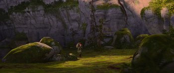 Movie still from “How to Train Your Dragon” (2010), directed by Chris Sanders – A person standing in the middle of a lush green forest; Extreme Wide shot, High angle