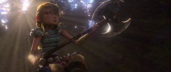 Movie still from “How to Train Your Dragon” (2010), directed by Chris Sanders – A young girl holding an axe in the woods; Medium shot, Low angle