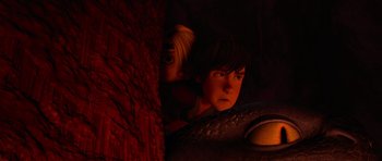 Movie still from “How to Train Your Dragon” (2010), directed by Chris Sanders – A boy and a girl looking at each other through a wall; Close Up shot, High angle