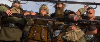 Movie still from “How to Train Your Dragon” (2010), directed by Chris Sanders – A couple of people that are standing up; Medium shot, Low angle