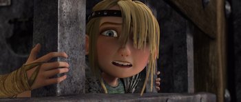 Movie still from “How to Train Your Dragon” (2010), directed by Chris Sanders – A cartoon of a girl with blonde hair looking out a window; Close Up shot, Low angle