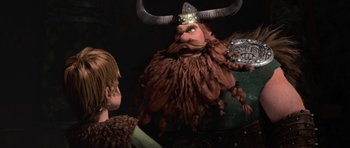 Movie still from “How to Train Your Dragon” (2010), directed by Chris Sanders – A man with a horned hat is looking at another man; Medium shot, Over the shoulder angle