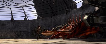 Movie still from “How to Train Your Dragon” (2010), directed by Chris Sanders – A dragon and a boy are in a building; Extreme Wide shot, High angle