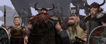 Movie still from “How to Train Your Dragon” (2010), directed by Chris Sanders – A couple of men standing next to each other; Medium shot, Low angle