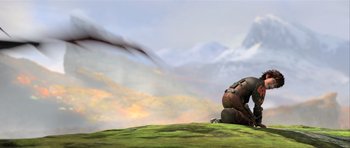 Movie still from “How to Train Your Dragon 2” (2014), directed by Dean DeBlois – An image of a person sitting on the ground; Wide shot, Low angle