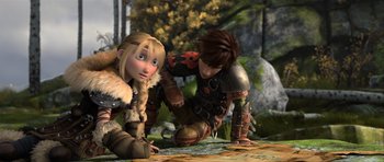 Movie still from “How to Train Your Dragon 2” (2014), directed by Dean DeBlois – A couple of people that are standing up in the grass; Wide shot, High angle