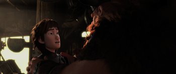 Movie still from “How to Train Your Dragon 2” (2014), directed by Dean DeBlois – A man with a beard is talking to a boy; Medium shot, Over the shoulder angle
