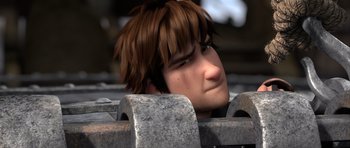 Movie still from “How to Train Your Dragon 2” (2014), directed by Dean DeBlois – A boy with brown hair is looking over a railing; Close Up shot, Low angle