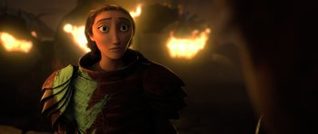 Movie still from “How to Train Your Dragon 2” (2014), directed by Dean DeBlois – A person with a fire in the background; Close Up shot, Over the shoulder angle