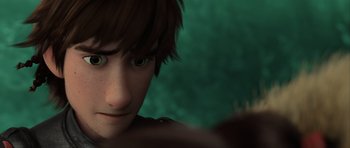 Movie still from “How to Train Your Dragon 2” (2014), directed by Dean DeBlois – A young boy's face with green eyes; Close Up shot, Over the shoulder angle