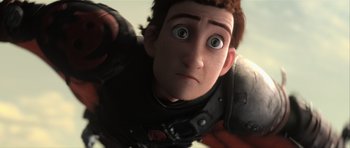 Movie still from “How to Train Your Dragon 2” (2014), directed by Dean DeBlois – A person's face as he looks upward; Close Up shot, Low angle