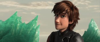 Movie still from “How to Train Your Dragon 2” (2014), directed by Dean DeBlois – A boy's face with a dragon in the background; Close Up shot, Over the shoulder angle