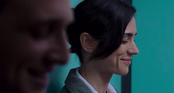 Movie still from “Hulk” (2003), directed by Ang Lee – A person with a smile on her face; Close Up shot, Over the shoulder angle