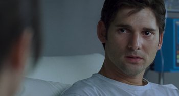 Movie still from “Hulk” (2003), directed by Ang Lee – A person wearing a white t - shirt; Close Up shot, Over the shoulder angle