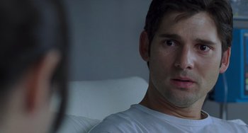 Movie still from “Hulk” (2003), directed by Ang Lee – A person sitting on a couch; Close Up shot, Over the shoulder angle