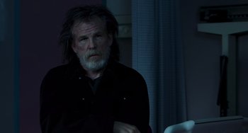 Movie still from “Hulk” (2003), directed by Ang Lee – An older man with long grey hair sitting in front of a window; Medium shot, Over the shoulder angle