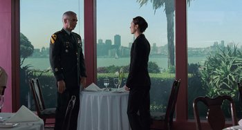 Movie still from “Hulk” (2003), directed by Ang Lee – A man and a woman standing in front of a table; Wide shot, Over the shoulder angle