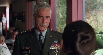 Movie still from “Hulk” (2003), directed by Ang Lee – An older man in a military uniform is looking at the camera; Close Up shot, Over the shoulder angle