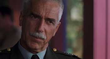 Movie still from “Hulk” (2003), directed by Ang Lee – An older man with a mustache wearing a military uniform; Close Up shot, Low angle
