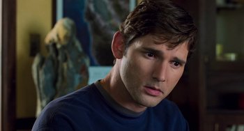 Movie still from “Hulk” (2003), directed by Ang Lee – A person wearing a blue t - shirt; Close Up shot, Over the shoulder angle