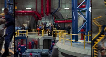 Movie still from “Hulk” (2003), directed by Ang Lee – A group of people standing in a room with pipes; Extreme Wide shot, High angle