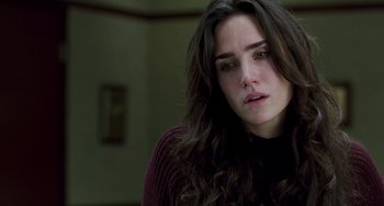 Movie still from “Hulk” (2003), directed by Ang Lee – A person with long brown hair; Close Up shot, Over the shoulder angle