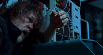 Movie still from “Hulk” (2003), directed by Ang Lee – A man holding a red object in his hand; Close Up shot, Low angle