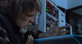 Movie still from “Hulk” (2003), directed by Ang Lee – An older man with long grey hair and a long beard; Close Up shot, Low angle