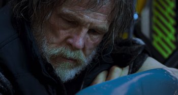 Movie still from “Hulk” (2003), directed by Ang Lee – An old man with a beard and a mustache is looking down; Close Up shot, Low angle