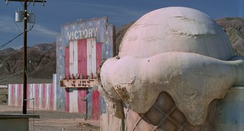 Movie still from “Hulk” (2003), directed by Ang Lee – An ice - cream sign in front of an ice - cream truck; Extreme Wide shot, High angle