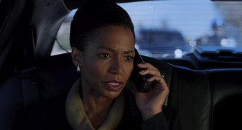 Movie still from “Hulk” (2003), directed by Ang Lee – A woman talking on a cell phone while sitting in the back of a car; Close Up shot, Low angle