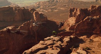 Movie still from “Hulk” (2003), directed by Ang Lee – A helicopter flying over a cliff in the middle of the desert; Extreme Wide shot, High angle