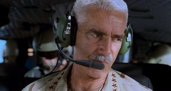 Movie still from “Hulk” (2003), directed by Ang Lee – An older man wearing a pair of headphones; Close Up shot, Low angle