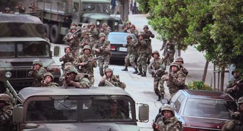 Movie still from “Hulk” (2003), directed by Ang Lee – A large group of men in uniform are marching down the street; Extreme Wide shot, High angle