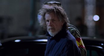 Movie still from “Hulk” (2003), directed by Ang Lee – An older man with long hair and a goatee; Close Up shot, Over the shoulder angle