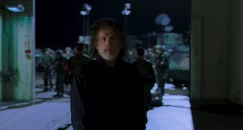 Movie still from “Hulk” (2003), directed by Ang Lee – An older man standing in front of a group of soldiers; Medium shot, Low angle