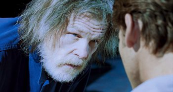 Movie still from “Hulk” (2003), directed by Ang Lee – An older man with a long beard talking to a younger man; Close Up shot, Over the shoulder angle