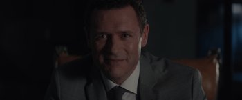 A person wearing a suit and tie