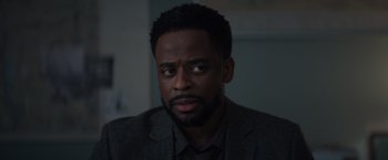 A person wearing a suit and tie