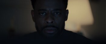A person's face in the dark