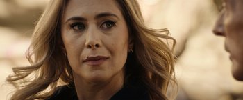 Movie still from “Hypnotic” (2023), directed by Robert Rodriguez – A woman's face with long blonde hair blowing in the wind; Close Up shot, Over the shoulder angle