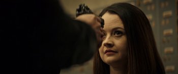 Movie still from “Hypnotic” (2023), directed by Robert Rodriguez – A woman is getting her hair cut by a man; Close Up shot, Over the shoulder angle
