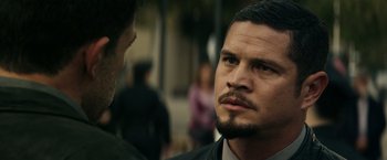 Movie still from “Hypnotic” (2023), directed by Robert Rodriguez – A person wearing a suit and beard; Close Up shot, Over the shoulder angle