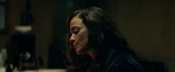 Movie still from “Hypnotic” (2023), directed by Robert Rodriguez – A person with long dark hair; Close Up shot, Over the shoulder angle