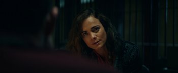 Movie still from “Hypnotic” (2023), directed by Robert Rodriguez – A person sitting in a room; Close Up shot, Over the shoulder angle