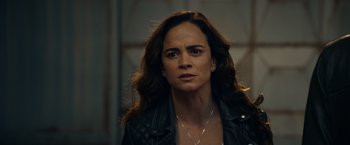 Movie still from “Hypnotic” (2023), directed by Robert Rodriguez – A person wearing a jacket; Close Up shot, Over the shoulder angle