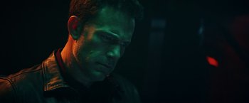 Movie still from “Hypnotic” (2023), directed by Robert Rodriguez – A person in a dark room; Close Up shot, High angle