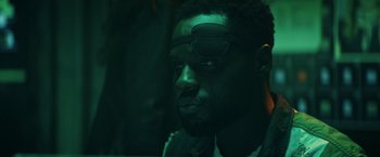 Movie still from “Hypnotic” (2023), directed by Robert Rodriguez – A person wearing a pair of sunglasses; Close Up shot, Over the shoulder angle